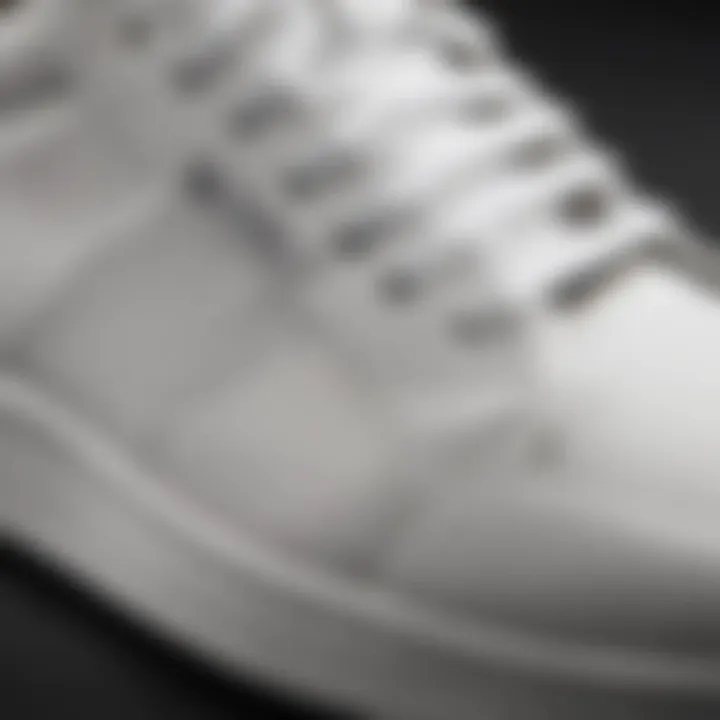 Close-up of white training shoes highlighting their durability and material quality.