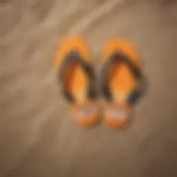 Stylish flip flops laid out on a beach
