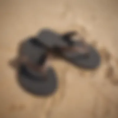 Flip flops being worn on a sandy beach setting