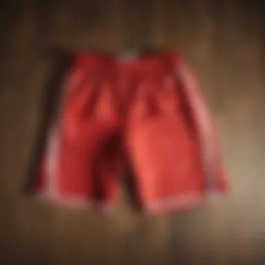 Stylish medium tall basketball shorts displayed on a wooden floor