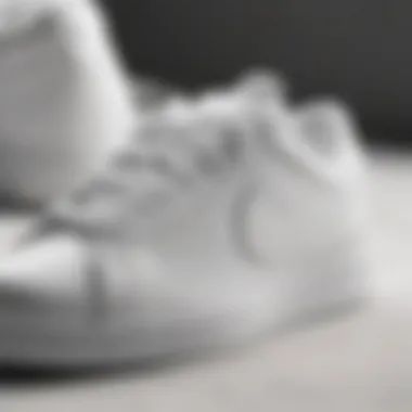 Stylish close-up of Nike white flat sneakers showcasing design details