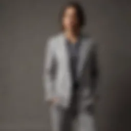Grey sweatshirt styled with oversized blazer and wide-leg pants