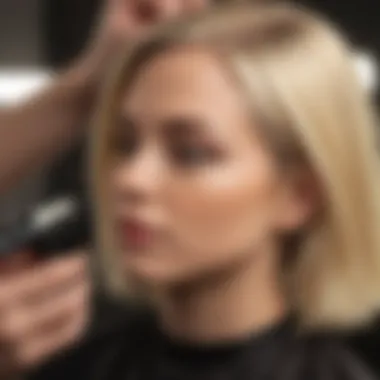 Hairdresser applying blonde dye with precision brush