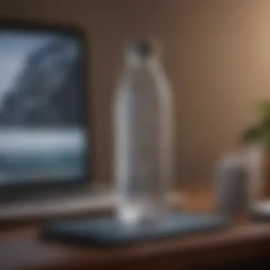 A refreshing water bottle placed next to a laptop on a desk.