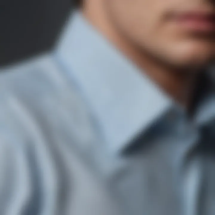 Close-up of the intricate stitching detail on a light blue Oxford shirt