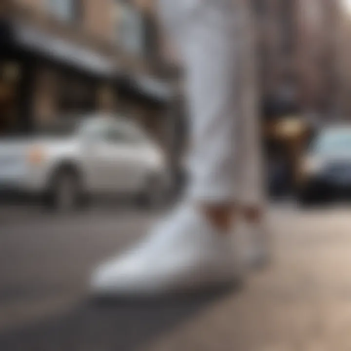 Kenneth Cole white sneakers showcased in a trendy urban environment