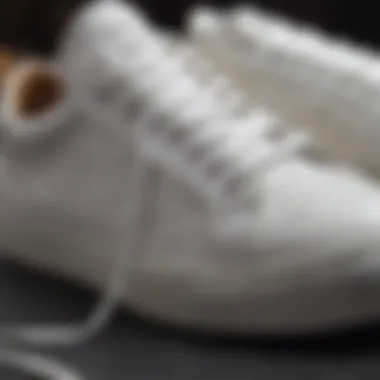 Close-up of white sneakers with intricate stitching details