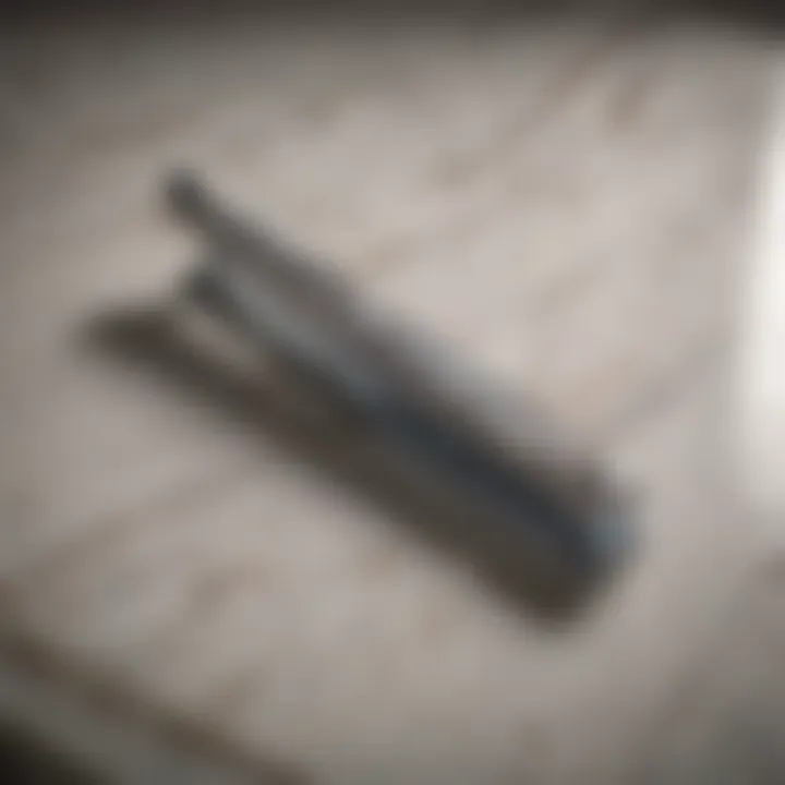 A close-up view of a razor blade on a marble countertop