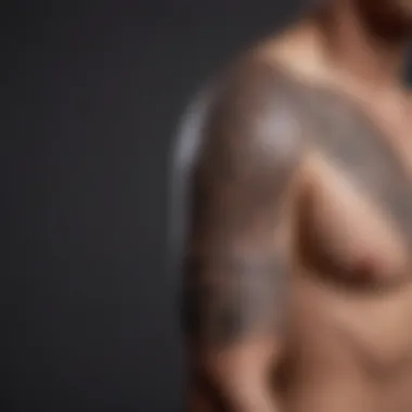 Bold Tribal Arm Tattoo An arm adorned with a bold tribal tattoo, emphasizing strong lines and patterns.