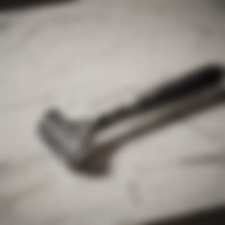 Close-up of a shaving razor on a marble countertop