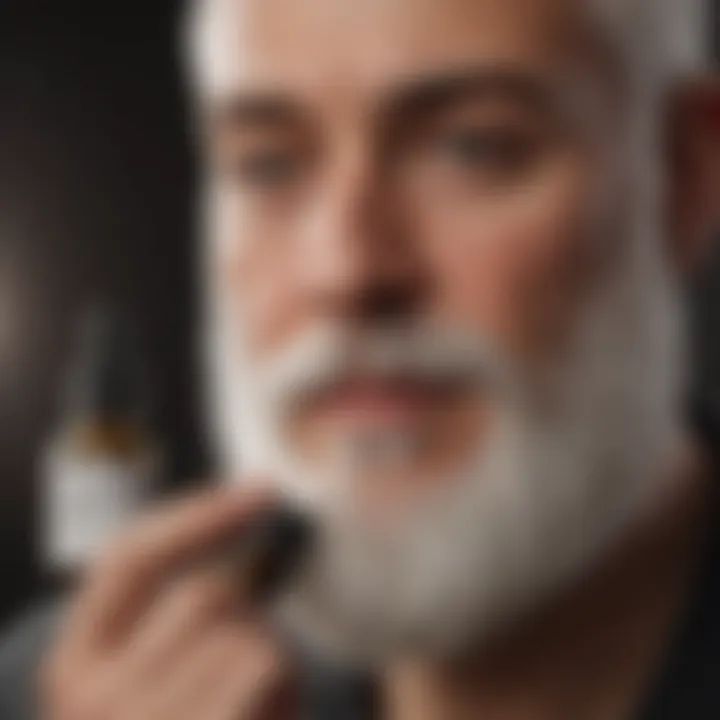 Man applying beard oil to a white beard