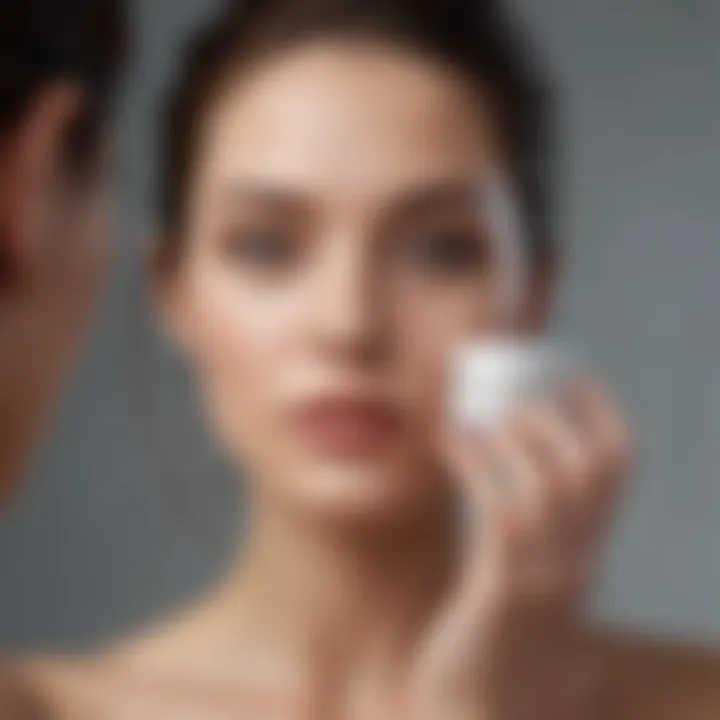 Elegant woman applying face cream